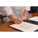 Bride signs documents