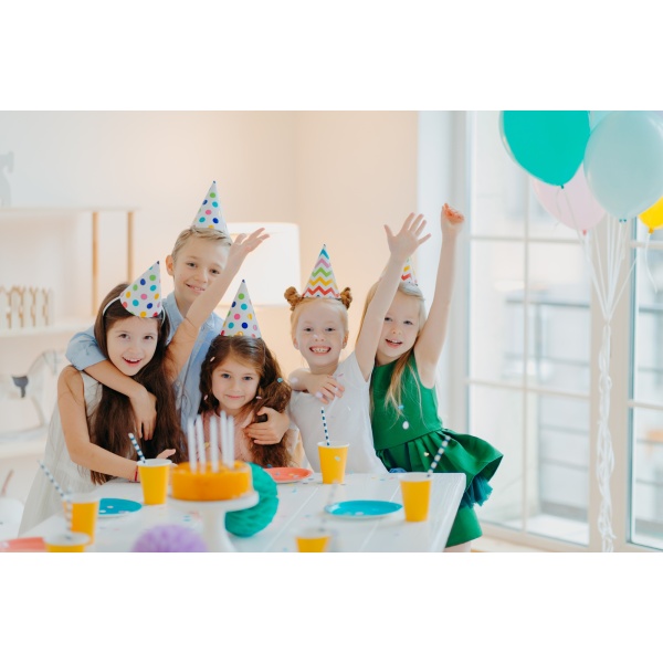 Kids party and celebration concept. Group of small children friends make photo together.