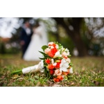 Wedding bouquet at grass background wedding couple